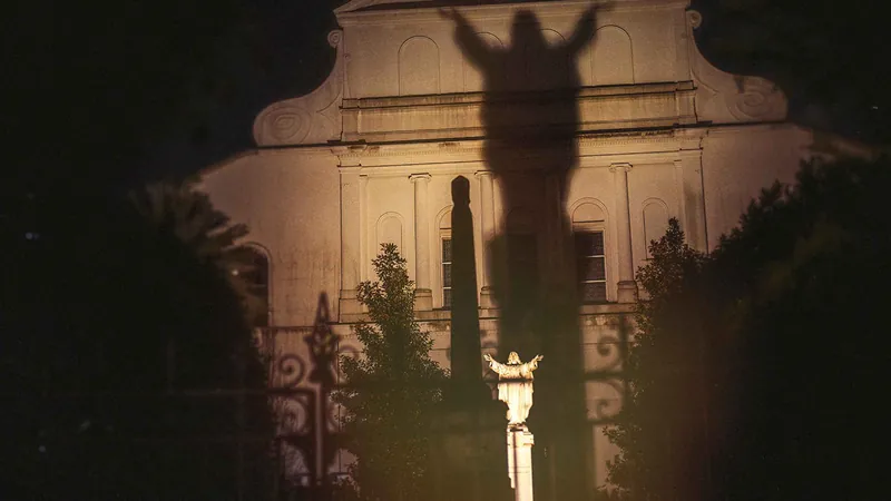 Adults-only New Orleans ghost tour group at Armstrong Park at night, Louisiana