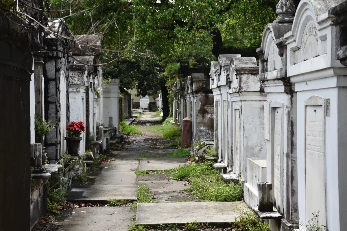 Tombs under trees in Lafayette Cemetery No. 1, one of the New Orleans cemeteries behind a ghost bus tour